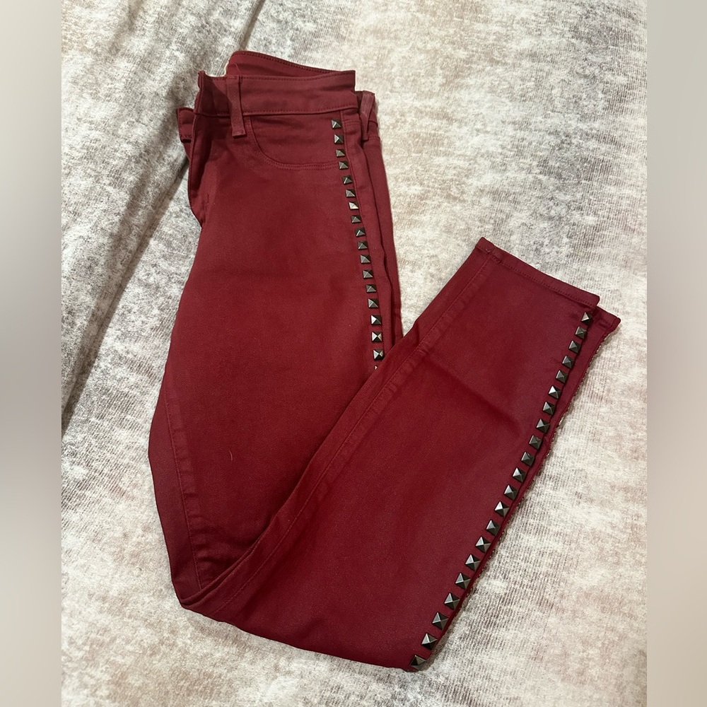 L’Agence red coated studded skinny jeans